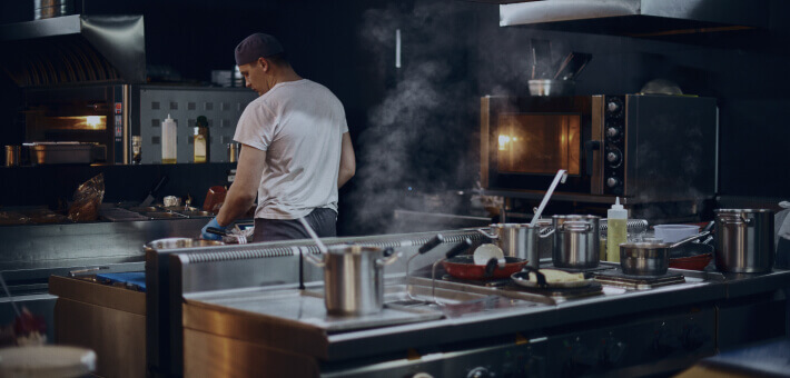 Kitchen preparation of a man's back view